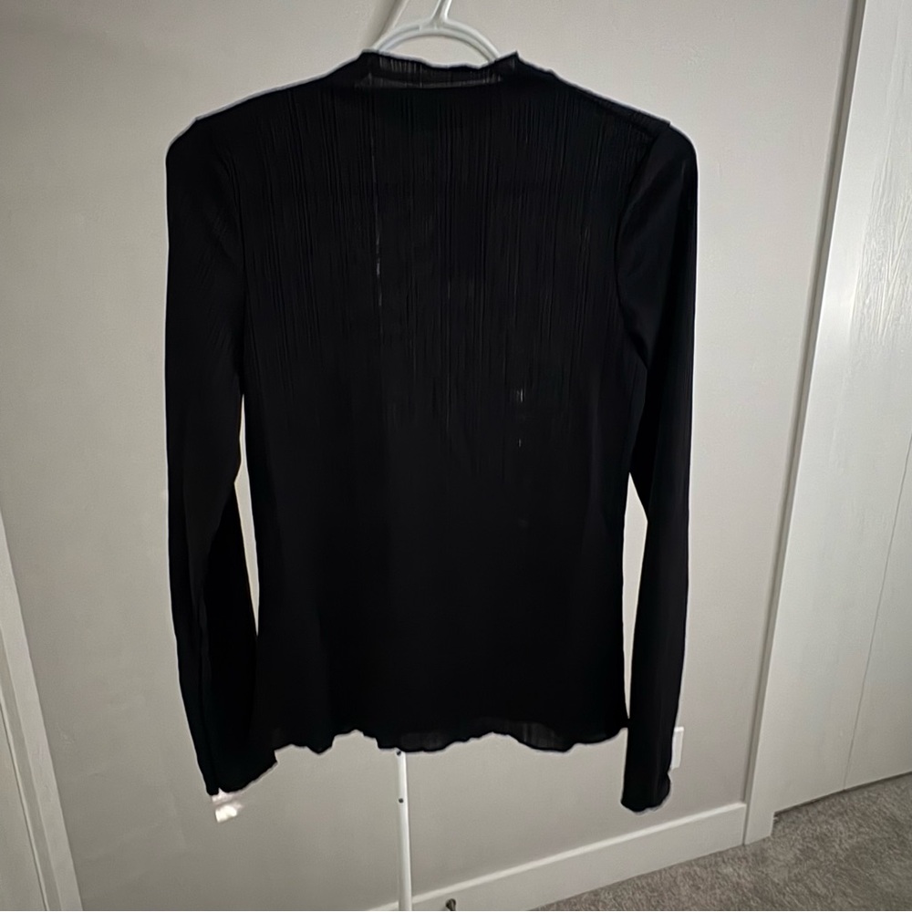 Ricki’s NWT black long sleeve top - Size Medium